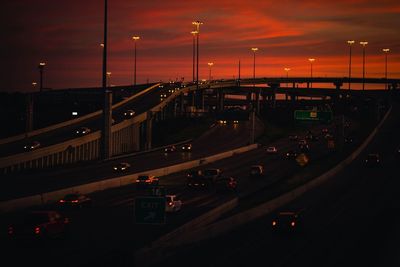 High angle view of vehicles on road at sunset