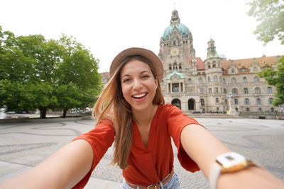 Beautiful excited school exchange girl takes self portrait in hanover, germany