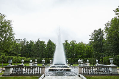 Fountain in park against sky