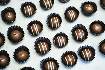 High angle view of chocolates on table at factory