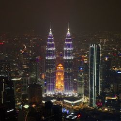 Illuminated buildings in city at night