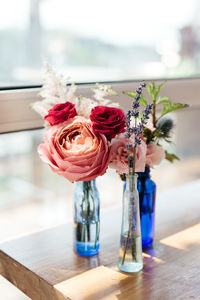 Close-up of rose in vase on table