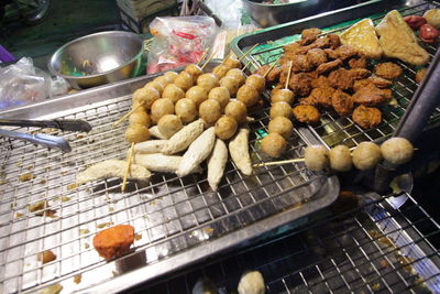 High angle view of meat on barbecue grill