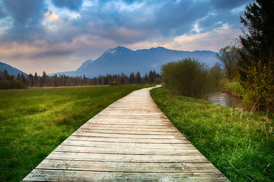 Scenic view of landscape against cloudy sky