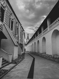 Low angle view of bridge against buildings