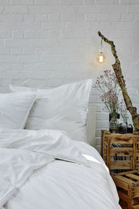White electric lamp on bed at home