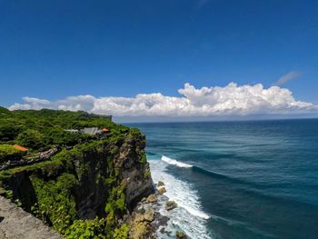 Scenic view of sea against blue sky