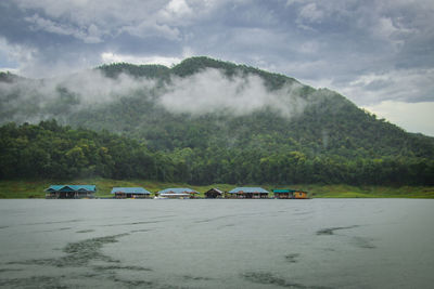 Scenic view of land and mountains against sky