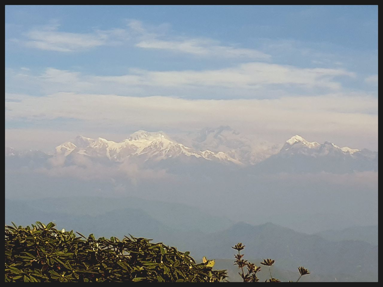 SCENIC VIEW OF CLOUDS OVER MOUNTAINS AGAINST SKY