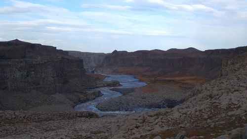 Scenic view of rocks against sky