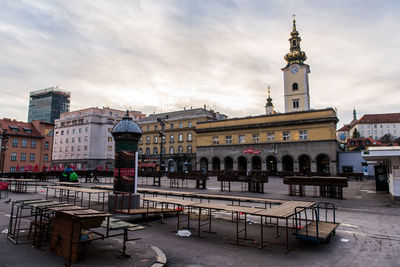 View of buildings against cloudy sky