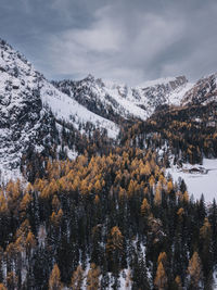 Scenic view of snowcapped mountains against sky during autumn