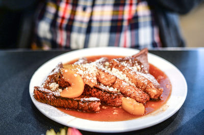 Close-up of breakfast served in plate on table