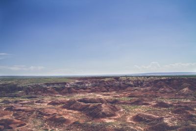 Scenic view of landscape against blue sky