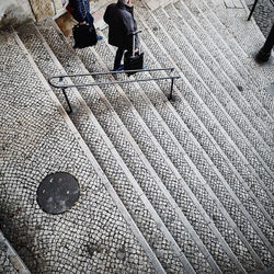 Low section of people walking on footpath