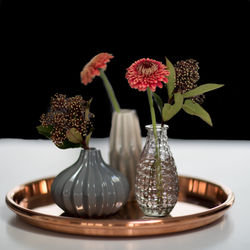 Close-up of flowers in vase on table