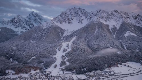 Snow covered mountains against sky