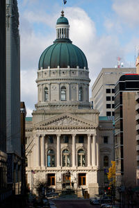 Buildings in city against sky