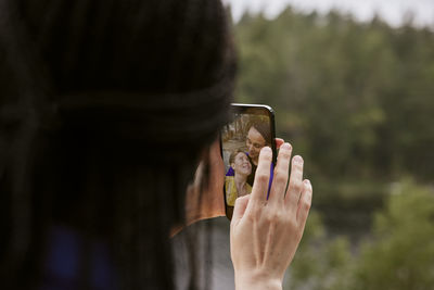 Female couple taking selfie outdoors