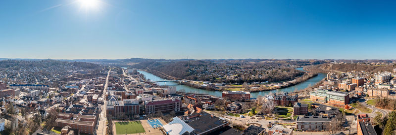 High angle view of townscape against clear blue sky