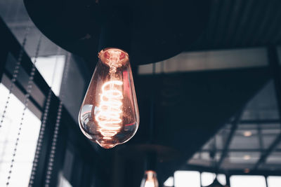 Low angle view of illuminated light bulb