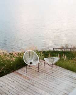 High angle view of lake with chair