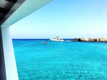 Scenic view of sea against clear blue sky