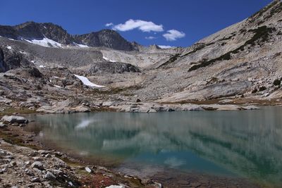 Scenic view of mount conness by lake against sky