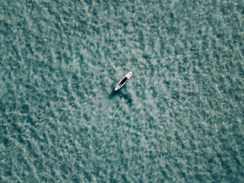 High angle view of surfer in sea