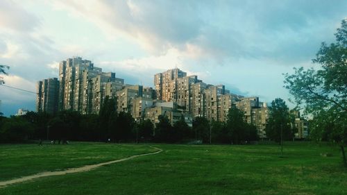 View of city against cloudy sky