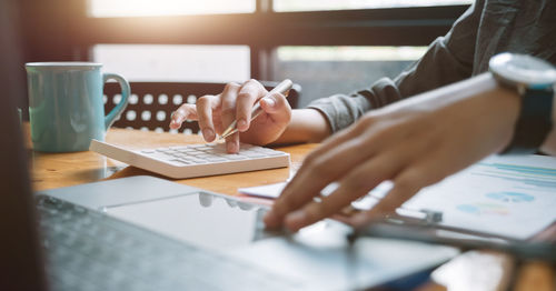 Woman using laptop on table