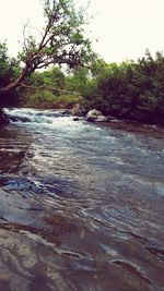 Scenic view of river against sky