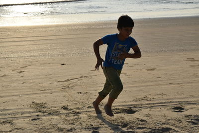 Full length of boy on beach