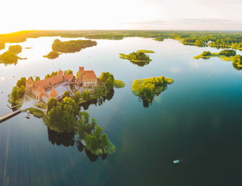 High angle view of plants by lake against sky