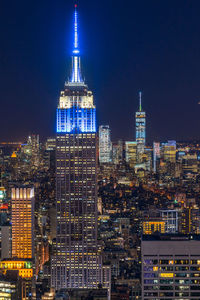 Illuminated buildings in city at night