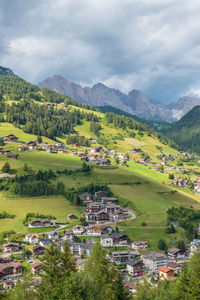 Scenic view of landscape and buildings against sky