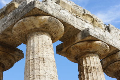 Low angle view of old ruins against sky