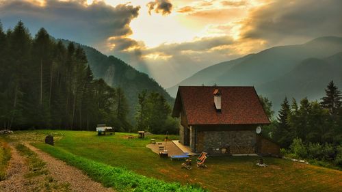 Panoramic view of agricultural field against sky