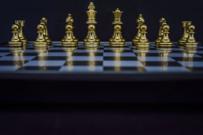 Close-up of chess pieces on table