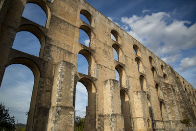 Low angle view of old ruins against sky