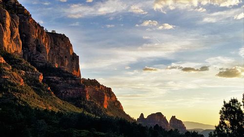 Idyllic view of mountains against sky during sunset