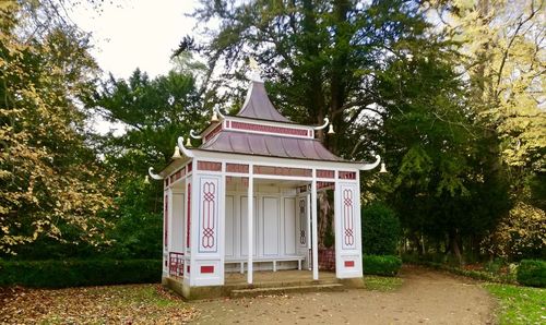 Exterior of house on field against trees in forest