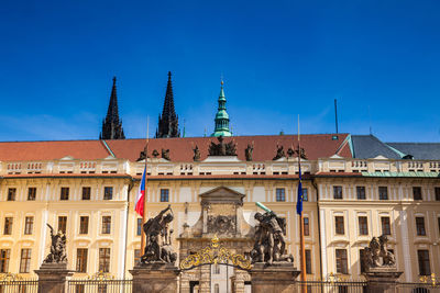 Statue of historic building against blue sky