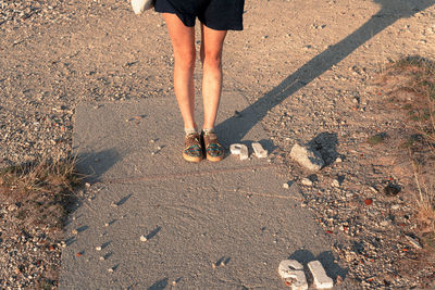 Low section of people walking on street