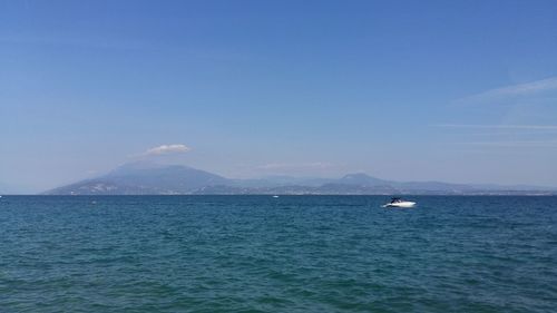 Scenic view of sea against blue sky