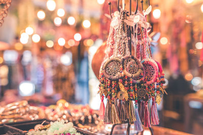 Close-up of decorations hanging at market stall