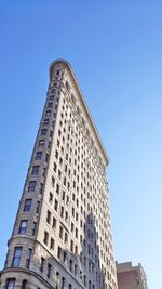 Low angle view of building against clear blue sky