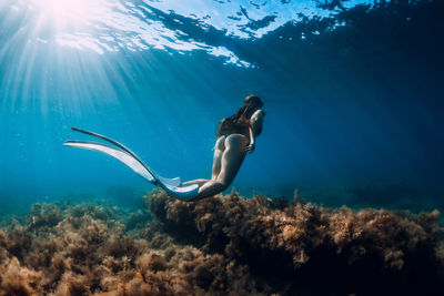 Full length of woman swimming in sea