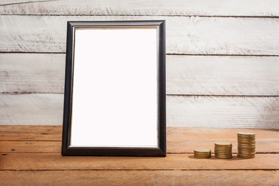 Stack of window on wooden table