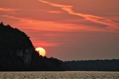 Scenic view of sea against orange sky